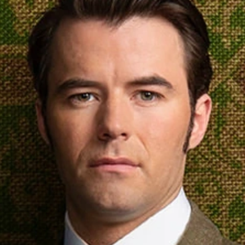 Arquivo:Tom Raikes (AID).png