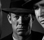Tenente Tom Polhaus em O Falcão Maltês (Telecine)